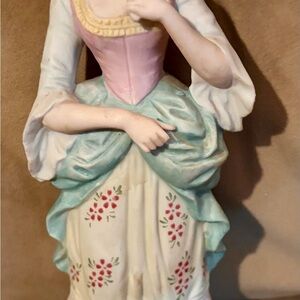 Vintage Figurines of women from Victorian era and baby.